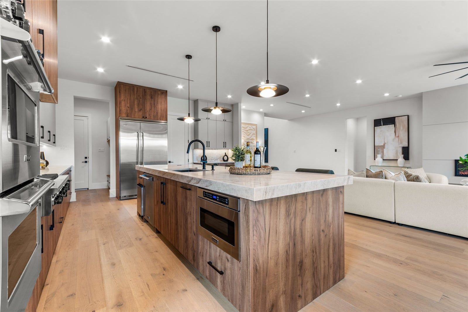 Kitchen with stone island and white oak cabinetry