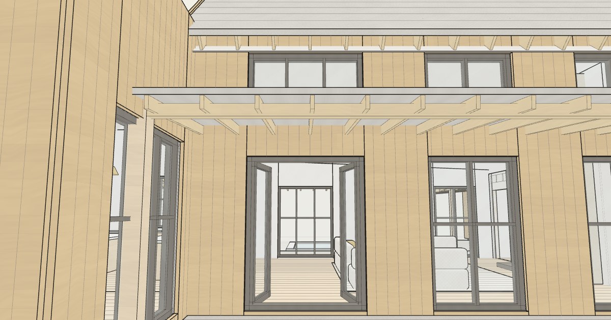 Covered rear porch of the farmhouse with exposed rafter tails and French doors into the great room